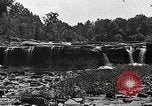 Image of activities near waterfall United States USA, 1916, second 28 stock footage video 65675068418