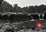 Image of activities near waterfall United States USA, 1916, second 29 stock footage video 65675068418