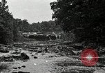 Image of activities near waterfall United States USA, 1916, second 34 stock footage video 65675068418