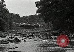 Image of activities near waterfall United States USA, 1916, second 40 stock footage video 65675068418