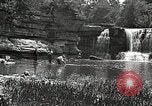 Image of activities near waterfall United States USA, 1916, second 42 stock footage video 65675068418
