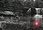 Image of activities near waterfall United States USA, 1916, second 43 stock footage video 65675068418
