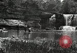Image of activities near waterfall United States USA, 1916, second 44 stock footage video 65675068418