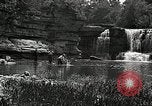 Image of activities near waterfall United States USA, 1916, second 46 stock footage video 65675068418