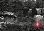 Image of activities near waterfall United States USA, 1916, second 47 stock footage video 65675068418