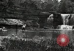 Image of activities near waterfall United States USA, 1916, second 48 stock footage video 65675068418