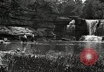 Image of activities near waterfall United States USA, 1916, second 49 stock footage video 65675068418