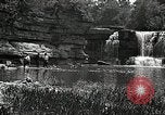 Image of activities near waterfall United States USA, 1916, second 50 stock footage video 65675068418