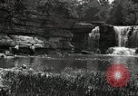 Image of activities near waterfall United States USA, 1916, second 51 stock footage video 65675068418