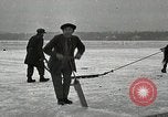 Image of Cutting ice blocks from a frozen lake United States USA, 1916, second 6 stock footage video 65675068419