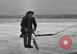 Image of Cutting ice blocks from a frozen lake United States USA, 1916, second 7 stock footage video 65675068419