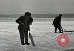 Image of Cutting ice blocks from a frozen lake United States USA, 1916, second 10 stock footage video 65675068419
