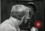 Image of Man listens to vintage radio United States USA, 1935, second 4 stock footage video 65675068706