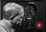 Image of Man listens to vintage radio United States USA, 1935, second 10 stock footage video 65675068706