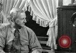 Image of Man listens to vintage radio United States USA, 1935, second 31 stock footage video 65675068706