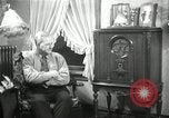 Image of Man listens to vintage radio United States USA, 1935, second 34 stock footage video 65675068706