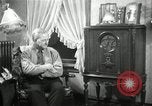 Image of Man listens to vintage radio United States USA, 1935, second 35 stock footage video 65675068706