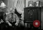Image of Man listens to vintage radio United States USA, 1935, second 41 stock footage video 65675068706