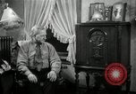 Image of Man listens to vintage radio United States USA, 1935, second 42 stock footage video 65675068706