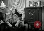 Image of Man listens to vintage radio United States USA, 1935, second 44 stock footage video 65675068706