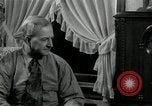 Image of Man listens to vintage radio United States USA, 1935, second 45 stock footage video 65675068706