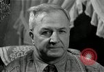 Image of Man listens to vintage radio United States USA, 1935, second 51 stock footage video 65675068706