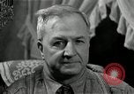 Image of Man listens to vintage radio United States USA, 1935, second 52 stock footage video 65675068706