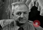 Image of Man listens to vintage radio United States USA, 1935, second 53 stock footage video 65675068706