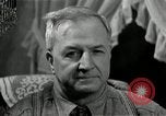 Image of Man listens to vintage radio United States USA, 1935, second 54 stock footage video 65675068706