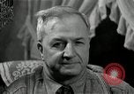 Image of Man listens to vintage radio United States USA, 1935, second 55 stock footage video 65675068706