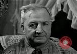 Image of Man listens to vintage radio United States USA, 1935, second 56 stock footage video 65675068706