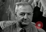 Image of Man listens to vintage radio United States USA, 1935, second 58 stock footage video 65675068706
