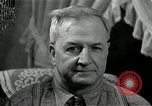 Image of Man listens to vintage radio United States USA, 1935, second 59 stock footage video 65675068706