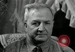 Image of Man listens to vintage radio United States USA, 1935, second 61 stock footage video 65675068706