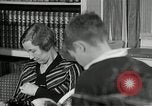 Image of American family listening to their radio United States USA, 1935, second 25 stock footage video 65675068707