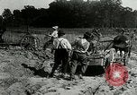 Image of tourists sightseeing in America in Model T cars Western United States USA, 1919, second 33 stock footage video 65675068821