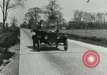 Image of tourists sightseeing in America in Model T cars Western United States USA, 1919, second 51 stock footage video 65675068821