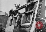 Image of clean up of bombing raid damage United Kingdom, 1940, second 13 stock footage video 65675068886