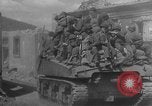 Image of U.S. forces pass through wrecked town near end of World War II Gemunden Germany, 1945, second 9 stock footage video 65675069289