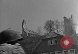 Image of U.S. forces pass through wrecked town near end of World War II Gemunden Germany, 1945, second 30 stock footage video 65675069289