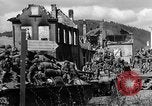 Image of U.S. forces pass through wrecked town near end of World War II Gemunden Germany, 1945, second 41 stock footage video 65675069289