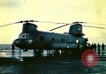 Image of VNAF helicopters on USS Midway during evacuation from Saigon South China Sea, 1975, second 3 stock footage video 65675069509