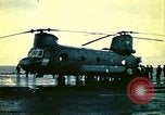 Image of VNAF helicopters on USS Midway during evacuation from Saigon South China Sea, 1975, second 4 stock footage video 65675069509
