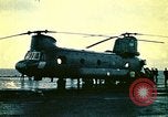 Image of VNAF helicopters on USS Midway during evacuation from Saigon South China Sea, 1975, second 5 stock footage video 65675069509