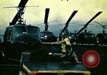 Image of VNAF helicopters on USS Midway during evacuation from Saigon South China Sea, 1975, second 11 stock footage video 65675069509
