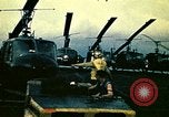 Image of VNAF helicopters on USS Midway during evacuation from Saigon South China Sea, 1975, second 12 stock footage video 65675069509