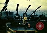Image of VNAF helicopters on USS Midway during evacuation from Saigon South China Sea, 1975, second 13 stock footage video 65675069509