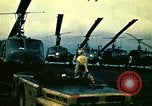 Image of VNAF helicopters on USS Midway during evacuation from Saigon South China Sea, 1975, second 14 stock footage video 65675069509