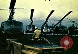 Image of VNAF helicopters on USS Midway during evacuation from Saigon South China Sea, 1975, second 15 stock footage video 65675069509