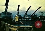 Image of VNAF helicopters on USS Midway during evacuation from Saigon South China Sea, 1975, second 17 stock footage video 65675069509